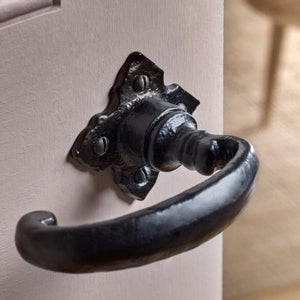 Bent Antique Black Iron Lever Door Handle On Petal Plate · Kirkpatrick 2471 ·